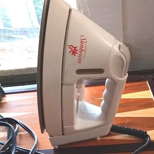 Sunbeam Steam Iron featuring Nonstick bottom.